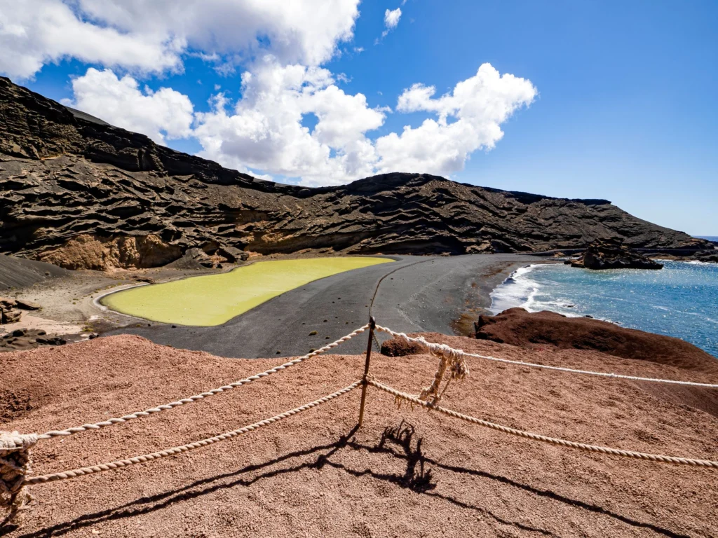 The green lagoon and black sand beach at El Golfo, Lanzarote